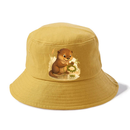 Otter weaving river reeds into a floating crown beside mirror-still water - Bucket Hat - Golden Harvest(Yellow)