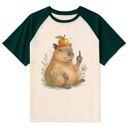 chonky capybara relaxing with orange on head, one webbed middle finger up - Contrast Raglan T-shirt - Green
