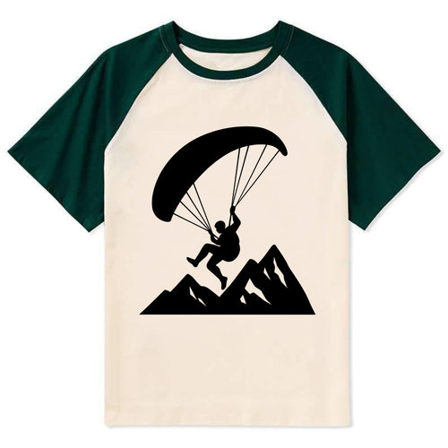 Paraglider soaring over mountain peaks - Contrast Raglan T-shirt