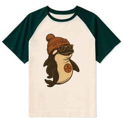 Victoria Orca wearing Victoria beanie with pom pom and wayfarer sunglasses - Contrast Raglan T-shirt - Green