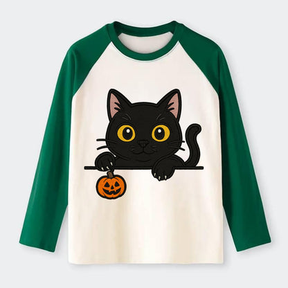 Midnight the black cat poking tongue out playfully while peeking. - Raglan Long Sleeve T-Shirt - Green