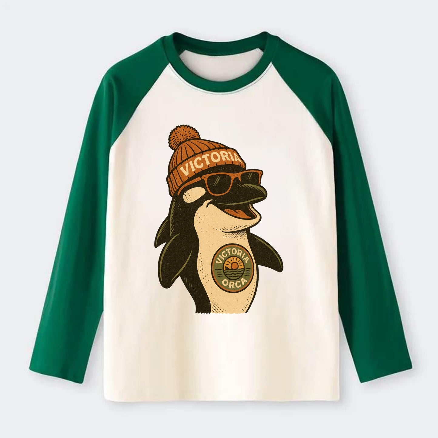 Victoria Orca wearing Victoria beanie wi - Raglan Long Sleeve T-Shirt - Green