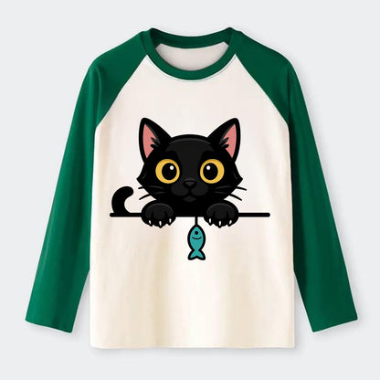 Midnight the black cat holding a tiny yarn ball between both paws - Raglan Long Sleeve T-Shirt - Green