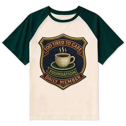 Crest with coffee cup - "Too Tired To Care Foundation - Daily Member" - - Contrast Raglan T-shirt - Green