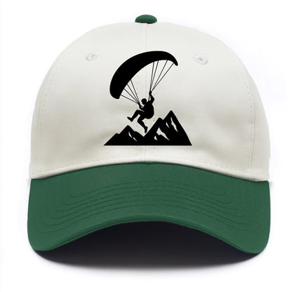 Paraglider soaring over mountain peaks - Two Tone Cap - Green