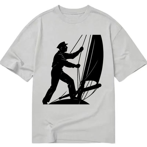 Sailor adjusting the boom on a sailboat - Classic T-shirt