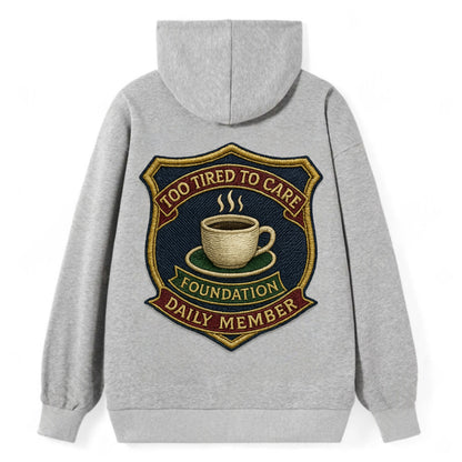 Crest with coffee cup - "Too Tired To Care Foundation - Daily Member" - - Classic Pullover Hoodie - Grey