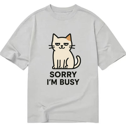 Cat sitting alone looking content - "SORRY I'M BUSY" - not sorry at all - Classic T-shirt - Grey