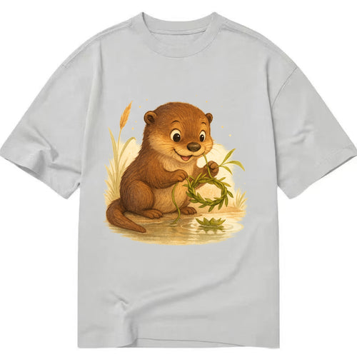 Otter weaving river reeds into a floating crown beside mirror-still water - Classic T-shirt