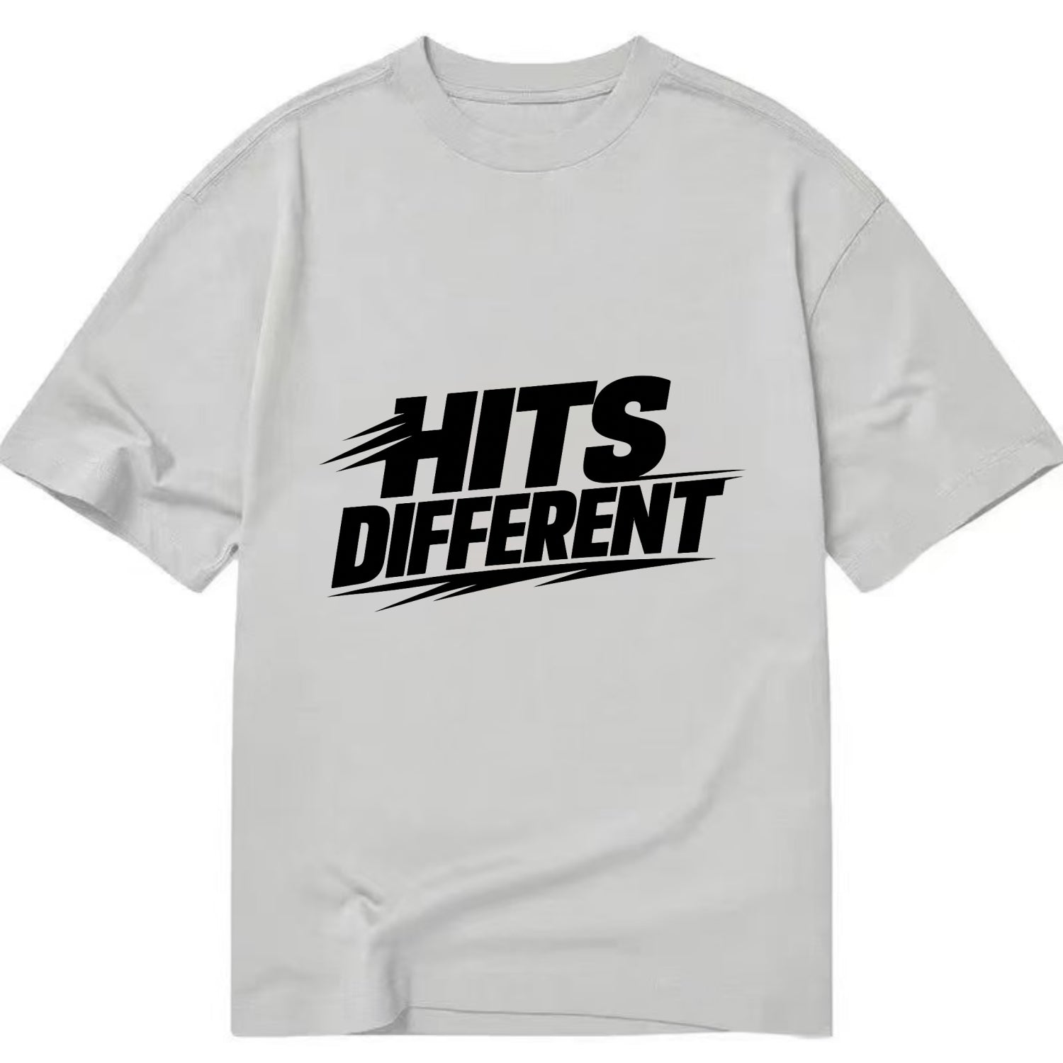 Bold typography design - "HITS DIFFERENT" - uniquely special, stands out - Classic T-shirt - Grey
