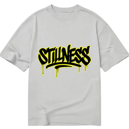 Bold typography design - "STILLNESS" - quiet power, peaceful presence - Classic T-shirt - Grey