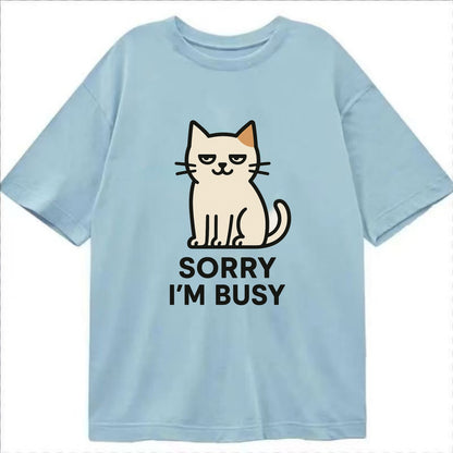 Cat sitting alone looking content - "SORRY I'M BUSY" - not sorry at all - Classic T-shirt - Light Blue