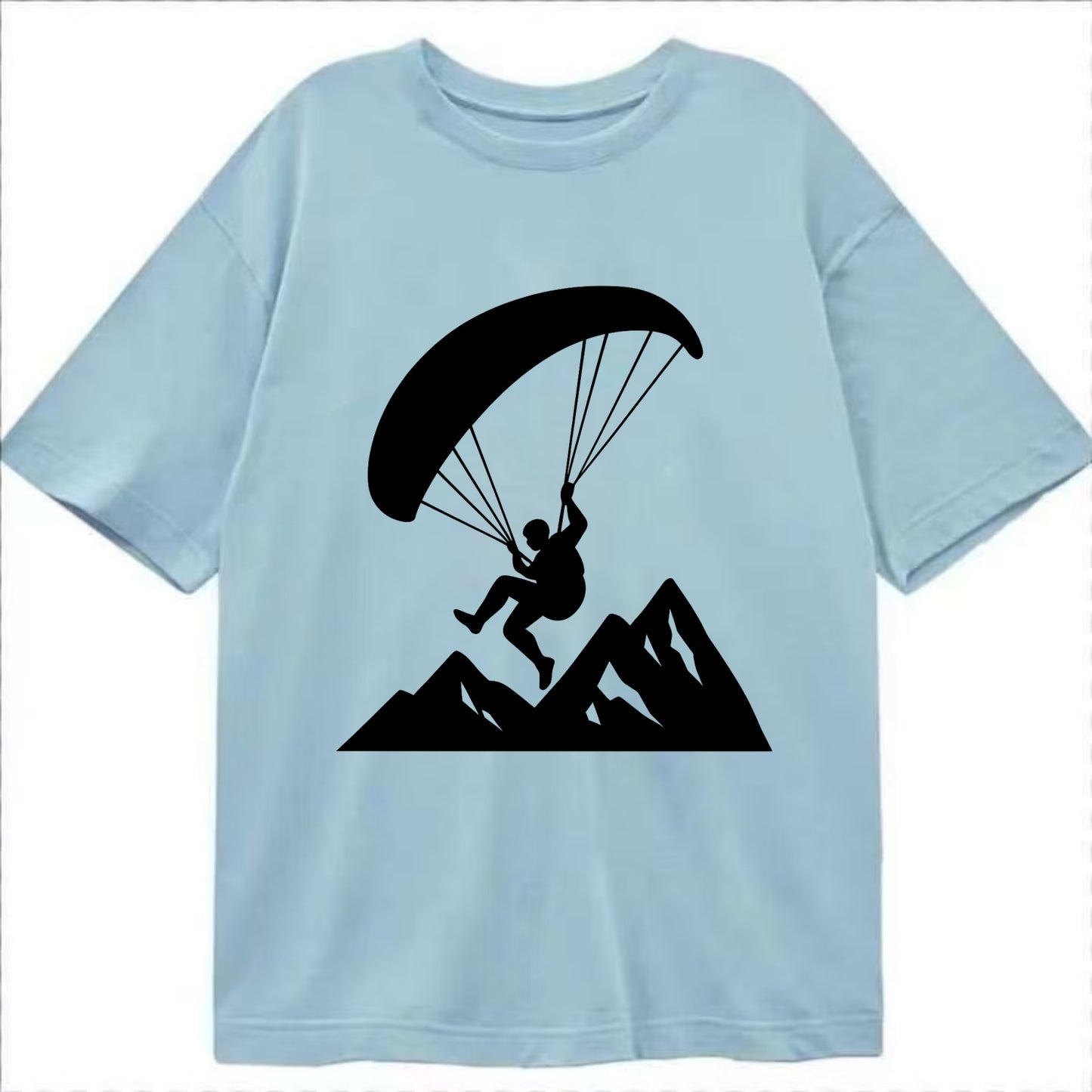 Paraglider soaring over mountain peaks - Classic T-shirt - Light Blue