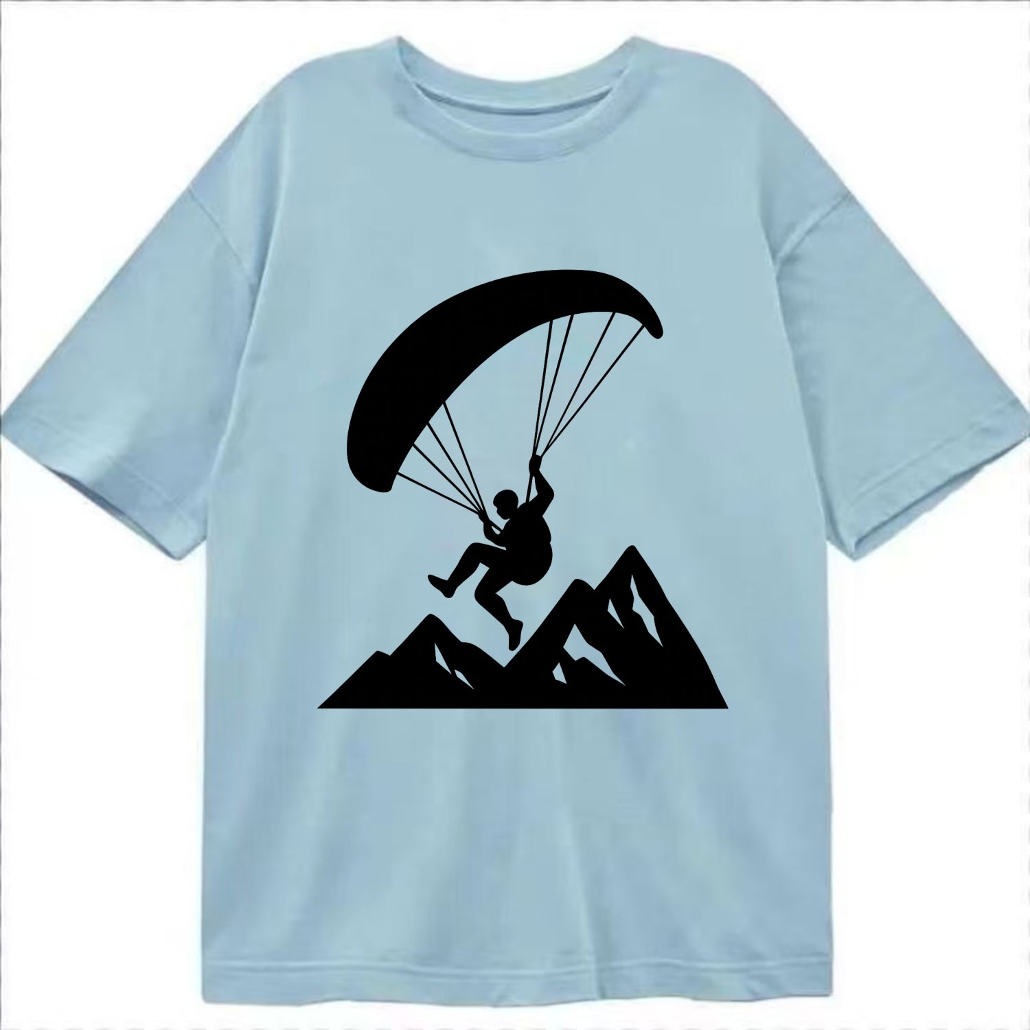 Paraglider soaring over mountain peaks - Classic T-shirt - Light Blue