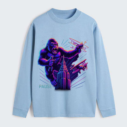 giant gorilla on top of skyscraper holding small figure, swatting planes - Classic Long Sleeve Shirt - Light Blue