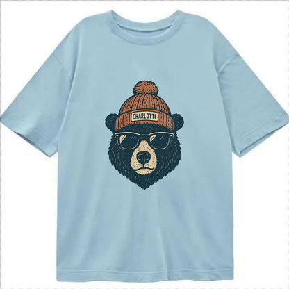 North Carolina Black Bear wearing Charlotte beanie with pom pom and wayfarer - Classic T-shirt - Light Blue