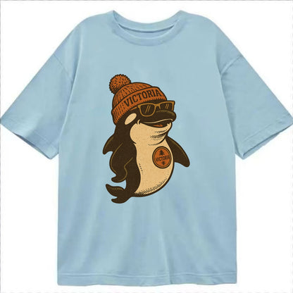 Victoria Orca wearing Victoria beanie with pom pom and wayfarer sunglasses - Classic T-shirt - Light Blue