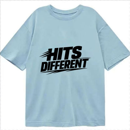 Bold typography design - "HITS DIFFERENT" - uniquely special, stands out - Classic T-shirt - Light Blue