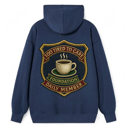Crest with coffee cup - "Too Tired To Care Foundation - Daily Member" - - Classic Pullover Hoodie - Navy