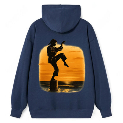 karate crane kick pose on wooden post at beach sunset - Classic Pullover Hoodie - Navy