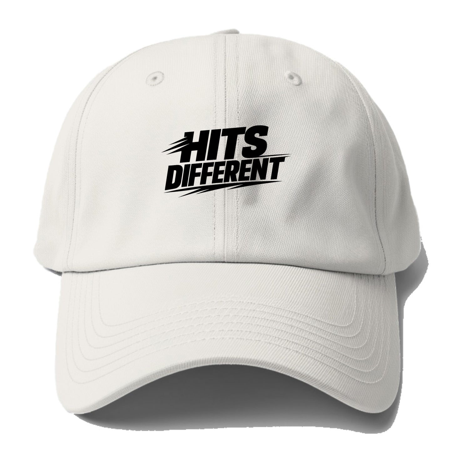 Bold typography design - "HITS DIFFERENT" - uniquely special, stands out - Baseball Cap - Off White