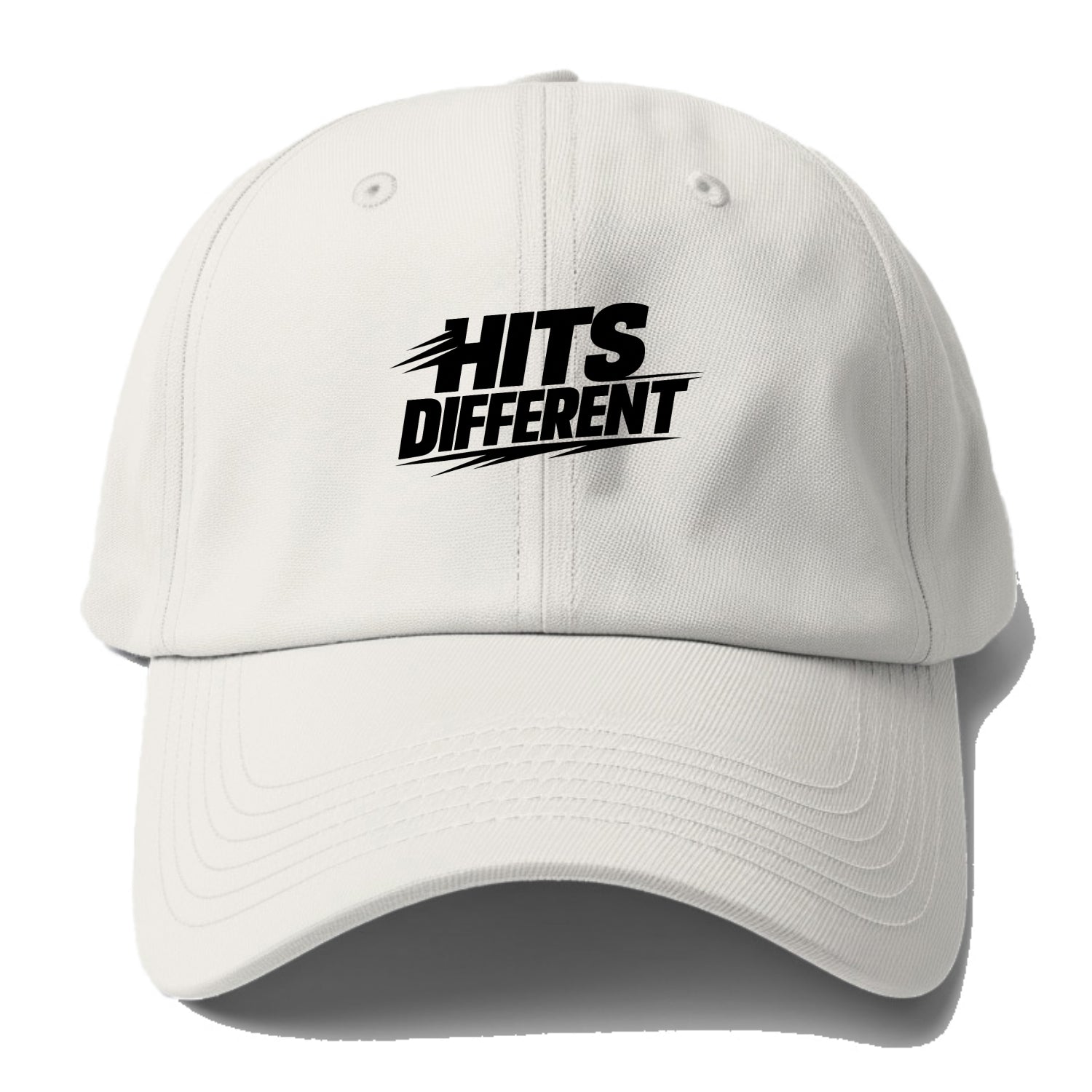 Bold typography design - "HITS DIFFERENT" - uniquely special, stands out - Baseball Cap - Off White
