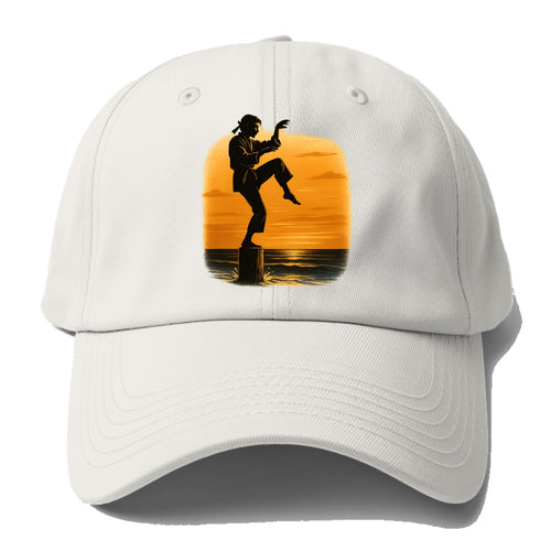 karate crane kick pose on wooden post at beach sunset - Baseball Cap