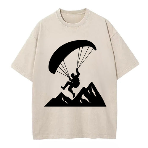 Paraglider soaring over mountain peaks - Vintage T-shirt