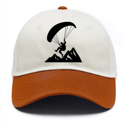 Paraglider soaring over mountain peaks - Two Tone Cap - Orange