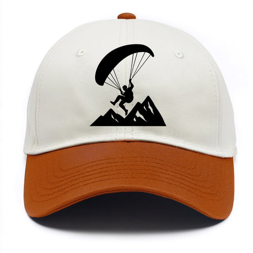 Paraglider soaring over mountain peaks - Two Tone Cap