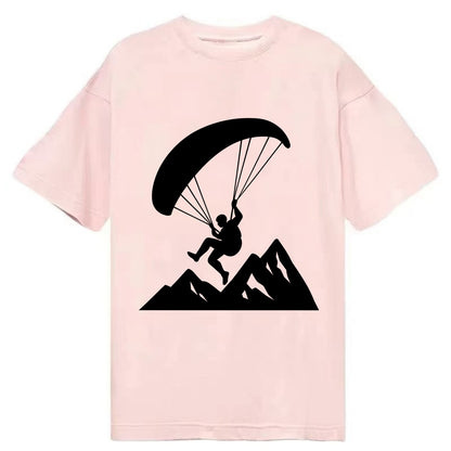 Paraglider soaring over mountain peaks - Classic T-shirt - Pink