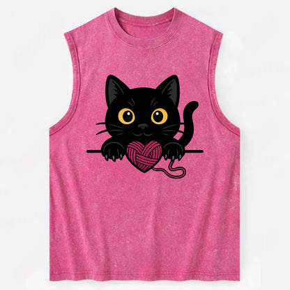 Midnight the black cat stretching tall with claws gently hooked over the edge. - Vintage Washed Tank - Pink