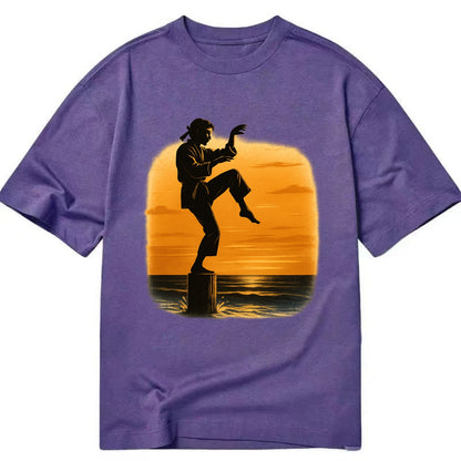 karate crane kick pose on wooden post at beach sunset - Classic T-shirt - Purple
