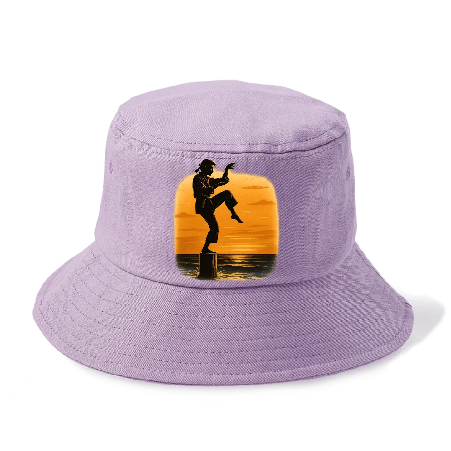 karate crane kick pose on wooden post at beach sunset - Bucket Hat - Purple