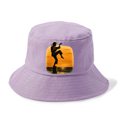 karate crane kick pose on wooden post at beach sunset - Bucket Hat - Purple