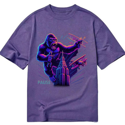 giant gorilla on top of skyscraper holding small figure, swatting planes - Classic T-shirt - Purple