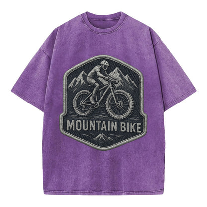 Mountain bike with rugged tires - cyclist badge - Vintage T-shirt - Purple