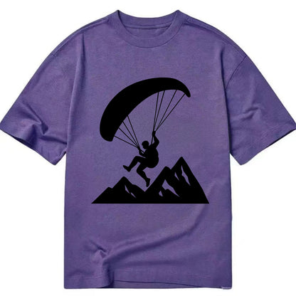 Paraglider soaring over mountain peaks - Classic T-shirt - Purple