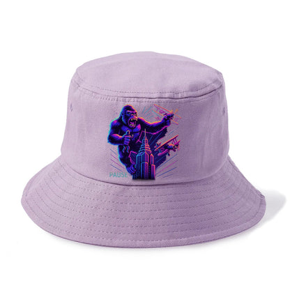 giant gorilla on top of skyscraper holding small figure, swatting planes - Bucket Hat - Purple