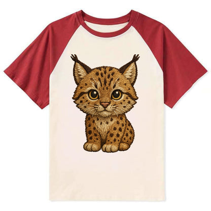 Baby Lynx Cub - tufted ears, spotted fur, golden eyes, front-facing, wild - Contrast Raglan T-shirt - Red