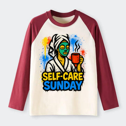 Person in bathrobe with face mask and tea - self-care Sunday ritual, - Raglan Long Sleeve T-Shirt - Red