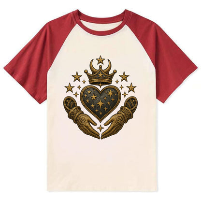 Weathered antique brass crown above a hammered gunmetal heart framed by - Contrast Raglan T-shirt - Red