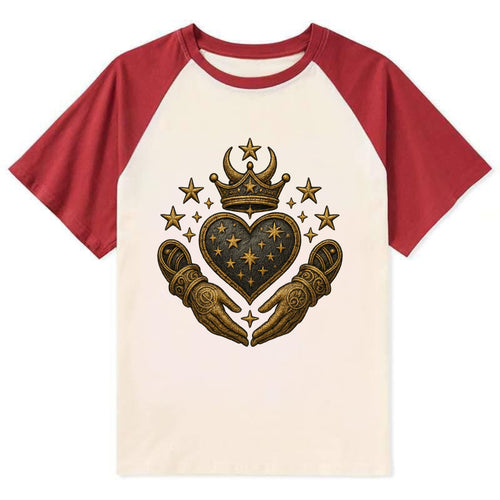Weathered antique brass crown above a hammered gunmetal heart framed by - Contrast Raglan T-shirt