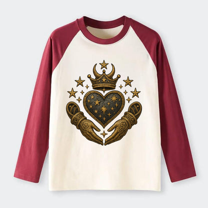 Weathered antique brass crown above a hammered gunmetal heart framed - Raglan Long Sleeve T-Shirt - Red