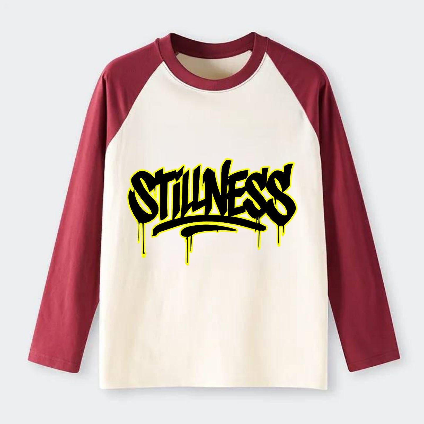 Bold typography design - "STILLNESS" - quiet power, peaceful presence - Raglan Long Sleeve T-Shirt - Red