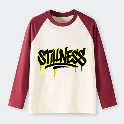 Bold typography design - "STILLNESS" - quiet power, peaceful presence - Raglan Long Sleeve T-Shirt - Red