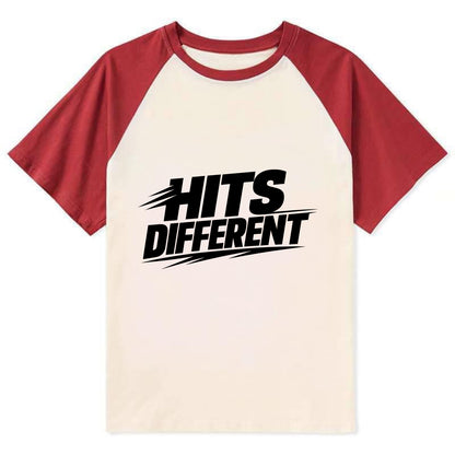 Bold typography design - "HITS DIFFERENT" - uniquely special, stands out - Contrast Raglan T-shirt - Red