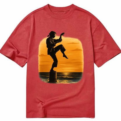 karate crane kick pose on wooden post at beach sunset - Classic T-shirt - Red