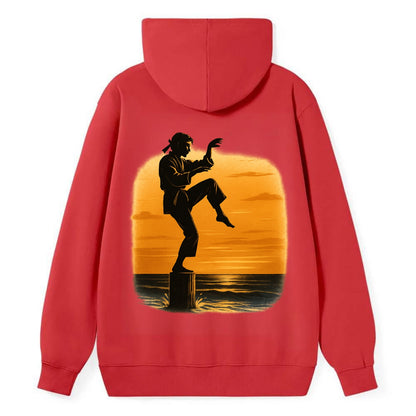 karate crane kick pose on wooden post at beach sunset - Classic Pullover Hoodie - Red
