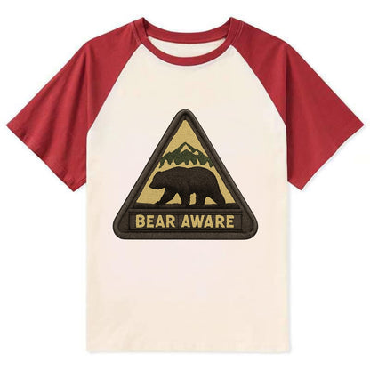 BEAR AWARE - bear silhouette warning in brown and yellow , wilderness - Contrast Raglan T-shirt - Red